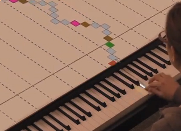 Met het Projected Instrument Augmentation System kan iedereen pianospelen
